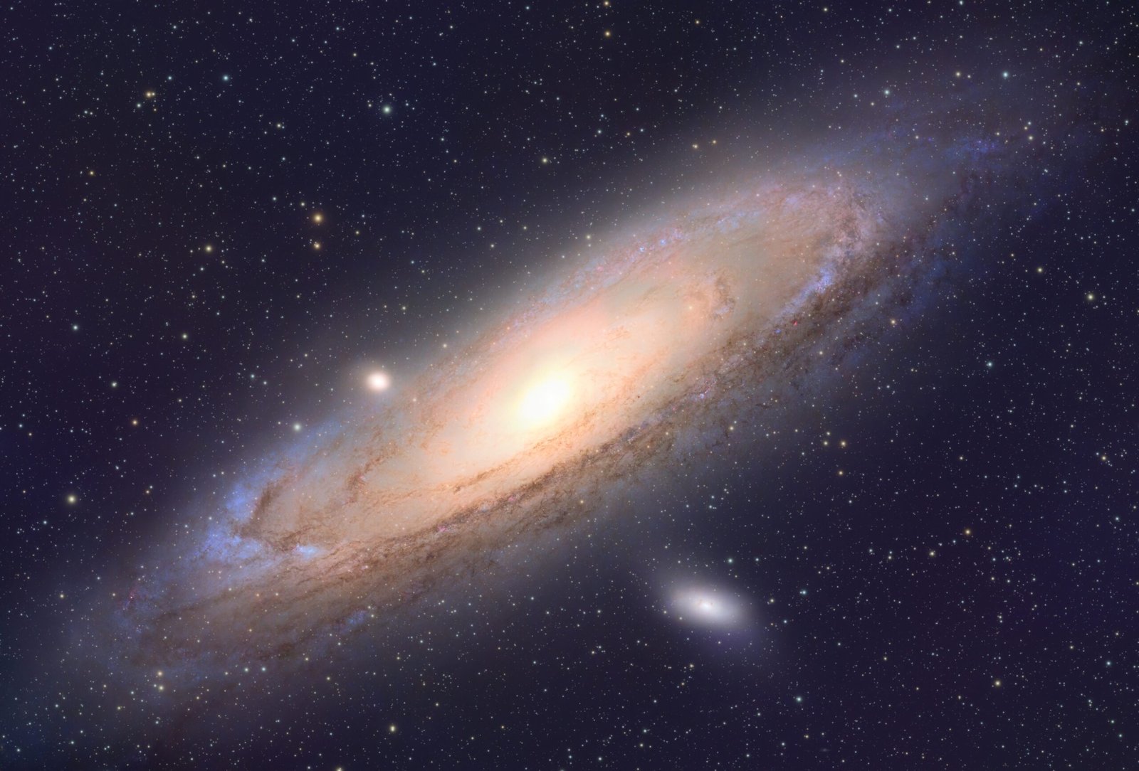 Andromeda Galaxy (M31), captured in detail showing its bright central core, sweeping spiral arms, dark dust lanes and surrounding star field.